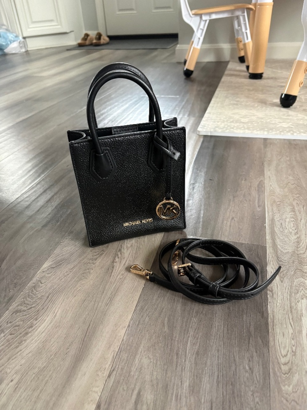 Black Mini Michael Kors handbag with crossbody strap